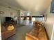 Open living area with a view of kitchen, dining area and pool at 2981 Kokomo Loop, Haines City, FL 33844