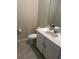Small bathroom with white vanity, toilet, and tiled floor at 2986 Aqua Virgo Loop, Orlando, FL 32837