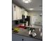 Modern kitchen with white cabinets, gray countertops, and island at 2986 Aqua Virgo Loop, Orlando, FL 32837