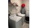 Laundry room with washer, dryer, and shelving at 2986 Aqua Virgo Loop, Orlando, FL 32837