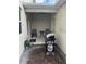 Covered patio with grill, table and chairs at 2986 Aqua Virgo Loop, Orlando, FL 32837
