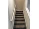 Indoor carpeted staircase with white railing at 2986 Aqua Virgo Loop, Orlando, FL 32837