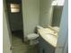 Elegant bathroom with a granite countertop vanity and tiled walk-in shower at 436 Michigan Ave, St Cloud, FL 34769