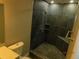 Modern bathroom features a newly tiled shower with built-in niche and modern fixtures at 436 Michigan Ave, St Cloud, FL 34769