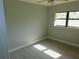 Cozy bedroom with tile flooring and natural light from a window at 436 Michigan Ave, St Cloud, FL 34769