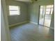 Bright bedroom featuring modern tile flooring and sliding glass doors at 436 Michigan Ave, St Cloud, FL 34769