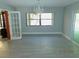 Dining room with modern floors, decorative lighting, and French doors at 436 Michigan Ave, St Cloud, FL 34769