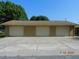 A three-car garage with separate bays and a large concrete driveway at 436 Michigan Ave, St Cloud, FL 34769