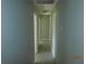 Hallway offers neutral wall colors, sleek trim, and modern tiled floors at 436 Michigan Ave, St Cloud, FL 34769