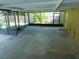 View of a screened-in patio with a concrete floor and views of the backyard at 436 Michigan Ave, St Cloud, FL 34769