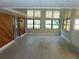 Enclosed sunroom with tile floors, paneling, and multiple windows for plenty of light at 436 Michigan Ave, St Cloud, FL 34769