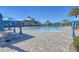 Resort-style pool with lounge chairs and blue umbrellas at 5043 Vantage Ct, St Cloud, FL 34772
