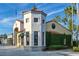 Charming building with unique architectural features, lush green vines, and tiled roof accents at 521 Milano Rd, Kissimmee, FL 34759