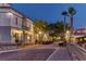 Charming street with decorative lights, palm trees, and parked golf carts at 521 Milano Rd, Kissimmee, FL 34759
