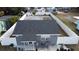 Aerial view showing a house with a fenced yard, driveway, and spacious backyard at 1107 Jersey Ave, Saint Cloud, FL 34769