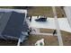 Aerial view of a house with a driveway and a car parked in front at 1107 Jersey Ave, Saint Cloud, FL 34769