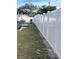 White vinyl fence encloses the side yard at 1107 Jersey Ave, Saint Cloud, FL 34769