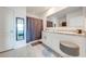 Modern bathroom with double vanity, granite countertops, and a shower at 1242 Iguana Loop, Davenport, FL 33897