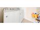 Convenient laundry room with washer, dryer, and storage at 1242 Iguana Loop, Davenport, FL 33897