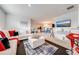 Spacious living room with a sectional sofa and modern decor at 1242 Iguana Loop, Davenport, FL 33897