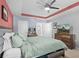 Main bedroom with a king bed and access to bathroom at 15335 White Tail Loop, Mascotte, FL 34753