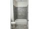 Clean bathroom with grey tile shower/tub combo at 1810 Dunbar St, Bartow, FL 33830