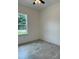 Bedroom with tile floor, window, and ceiling fan at 1810 Dunbar St, Bartow, FL 33830