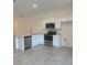 Modern kitchen with island, stainless steel appliances, and white cabinets at 1810 Dunbar St, Bartow, FL 33830