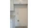 Laundry closet with washer/dryer hookups and cabinets at 1810 Dunbar St, Bartow, FL 33830