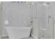 Spa-like bathroom with soaking tub and walk-in shower, marble finishes at 1812 Corolla Ct, Deltona, FL 32738