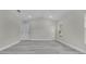 Bright bedroom with grey wood-look flooring and a large window at 1812 Corolla Ct, Deltona, FL 32738