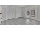 Bright bedroom with double doors leading to the backyard and ample closet space at 1812 Corolla Ct, Deltona, FL 32738