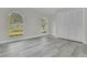 Spacious bedroom with arched windows and built-in closet at 1812 Corolla Ct, Deltona, FL 32738