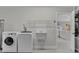 Convenient laundry room with washer, dryer, and utility sink at 1812 Corolla Ct, Deltona, FL 32738