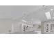 Open floor plan living room with high ceilings, skylights and kitchen at 1812 Corolla Ct, Deltona, FL 32738