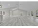 Open floor plan living room with high ceilings and kitchen at 1812 Corolla Ct, Deltona, FL 32738
