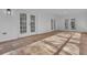 Screened porch with tile flooring and French doors at 1812 Corolla Ct, Deltona, FL 32738