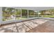 Spacious screened porch with terracotta tile flooring and access to the backyard at 1812 Corolla Ct, Deltona, FL 32738