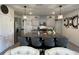 Spacious kitchen island with seating, granite countertops, stainless steel appliances and decorative lighting at 2459 Taloncrest Ct, Eagle Lake, FL 33839