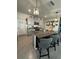 Spacious kitchen island with seating, granite countertops, stainless steel appliances and decorative lighting at 2459 Taloncrest Ct, Eagle Lake, FL 33839