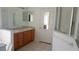 Bathroom featuring a double sink vanity, a glass shower, and a separate tub at 2645 Oneida Loop, Kissimmee, FL 34747