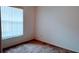 Cozy bedroom features natural light from the window and plush carpet at 2645 Oneida Loop, Kissimmee, FL 34747