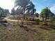 Community park trails with shade trees and lush landscaping at 2645 Oneida Loop, Kissimmee, FL 34747