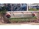 Indian Creek Community Sign with lush landscaping and wreaths at 2645 Oneida Loop, Kissimmee, FL 34747