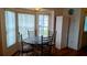 Cozy breakfast nook featuring a round table with four chairs and a bright window at 2645 Oneida Loop, Kissimmee, FL 34747