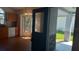 Entryway with view of the kitchen, featuring a decorative glass door and tiled backsplash at 2645 Oneida Loop, Kissimmee, FL 34747