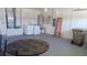 Spacious garage with a round table, laundry, shelving, and ample storage space at 2645 Oneida Loop, Kissimmee, FL 34747