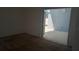 Living room with tan carpet and sliding door access to outdoor patio at 2645 Oneida Loop, Kissimmee, FL 34747