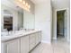Double vanity bathroom with walk-in closet at 304 Sorrento Road, Poinciana, FL 34759