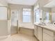 Bathroom with tub, shower, and vanity at 304 Sorrento Road, Poinciana, FL 34759
